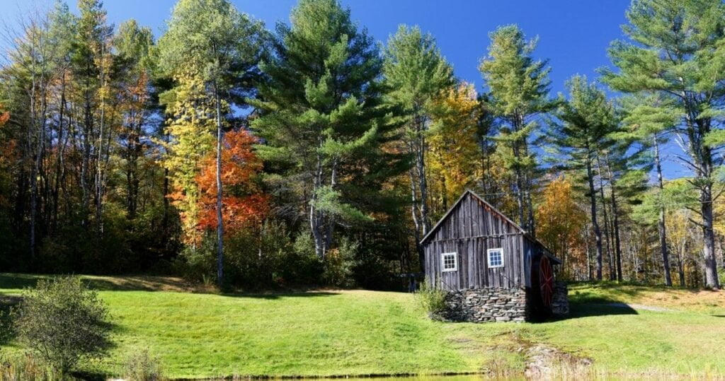 The Vermont Country Store Grist Mill and colorful foliage in Grafton, Vermont