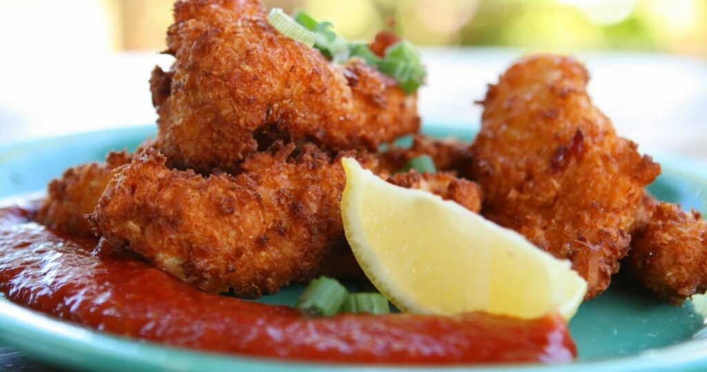 conch fritters with lemon and cocktail sauce