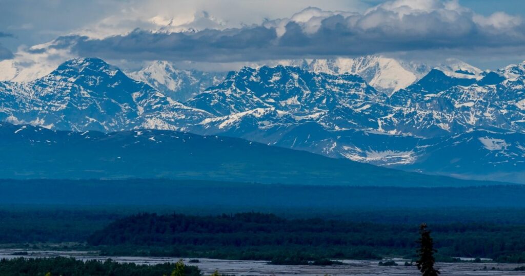 Snowy mountains, rivers, and forests in Denali, Denali National Park and Preserve, Alaska, USA