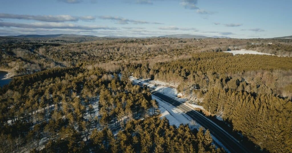 A winter aerial view of Neversink with snow and green forests, Catskill Mountains, Shandaken, New York, USA