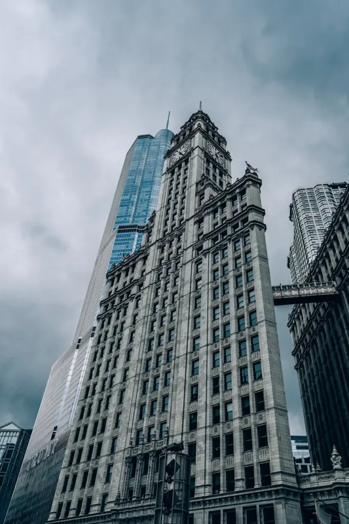 Low angle view of iconic Chicago skyscrapers, under a dramatic sky.