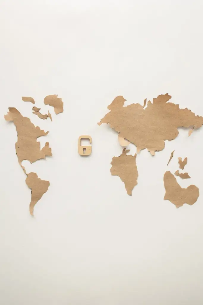 Artistic papercraft world map with a wooden padlock symbolizing security and connectivity.