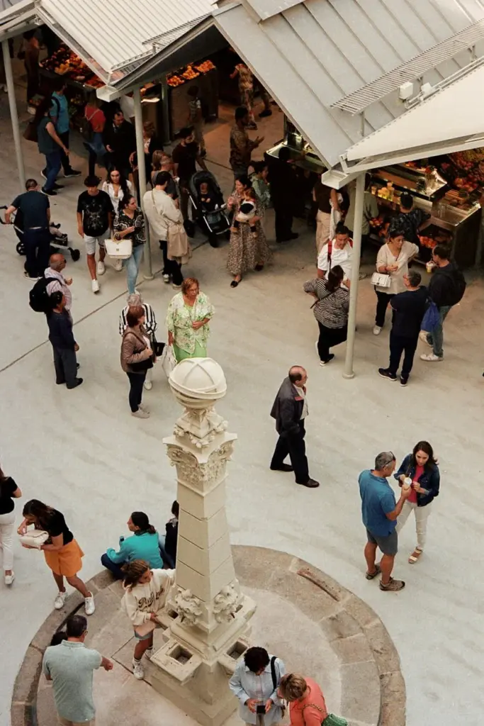 A bustling scene at Mercado do Bolhão in Porto, showcasing daily life and commerce.
