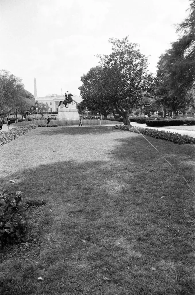 Black and white view of a monument at Lafayette Square, Washington D.C., with surrounding park area.