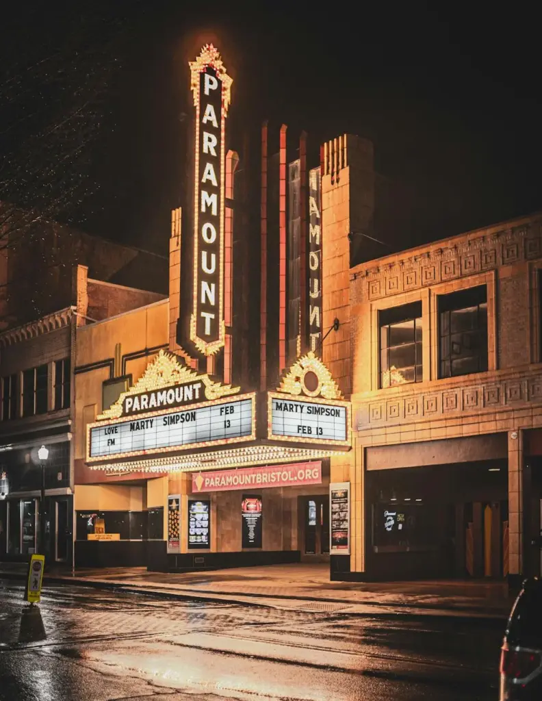 Paramount Theater lit up at night with vintage marquee and art deco styling.