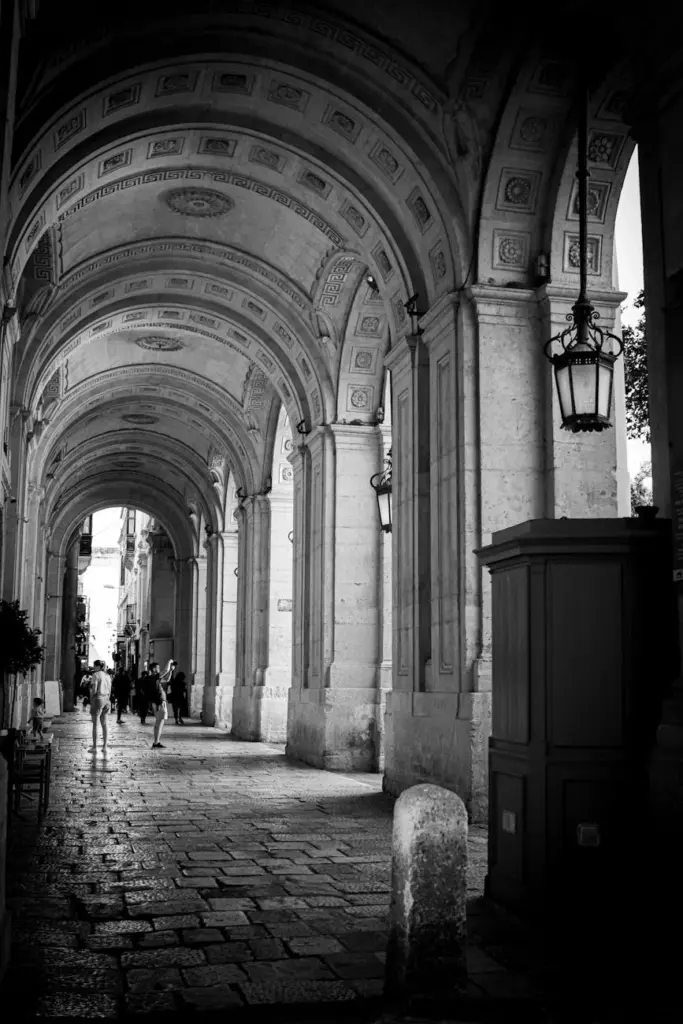 Explore the historic arches of Valletta, Malta in this monochrome photography.
