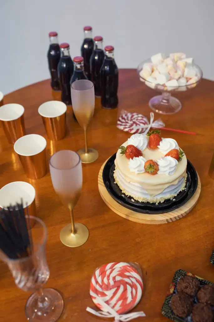 Festive table in Brazil with cake, drinks, and treats ready for celebration.