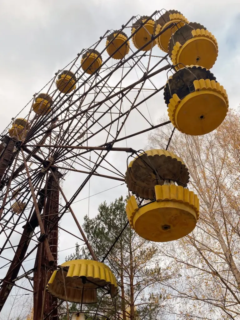 Low angle view of an abandoned Ferris wheel at Pripyat, Chornobyl, Ukraine, showing decay over time.