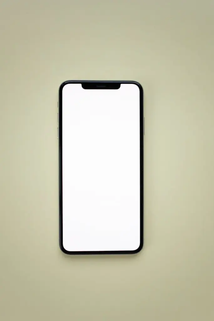 A blank smartphone screen mockup on a pastel yellow background. Ideal for app presentations.