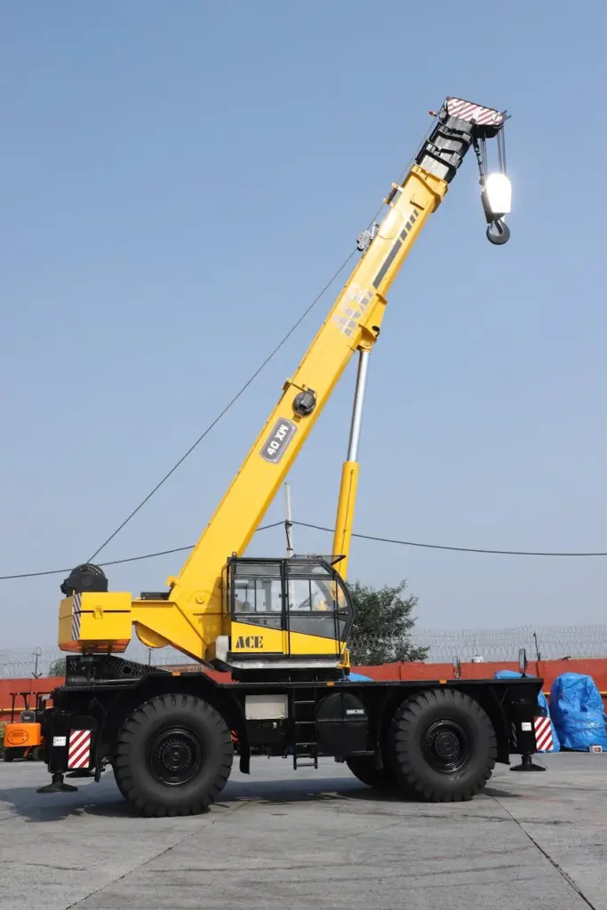 Yellow ACE 40 ton mobile crane in an industrial setting, Faridabad, India.