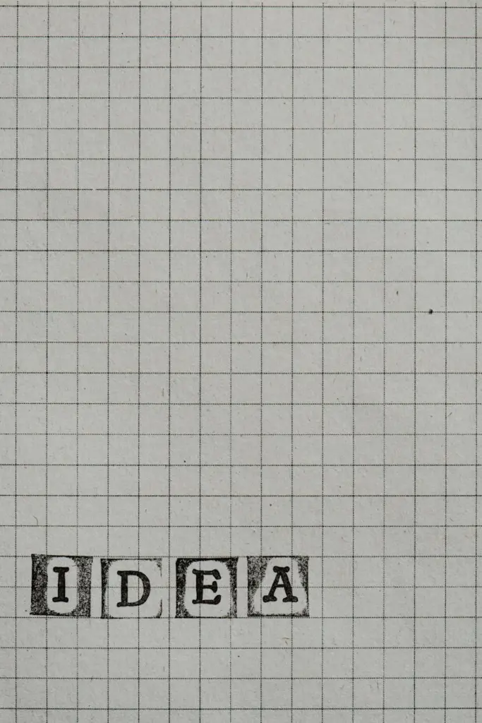 Minimalist grid paper with stamped typography spelling 'IDEA'. Perfect for creative concepts.