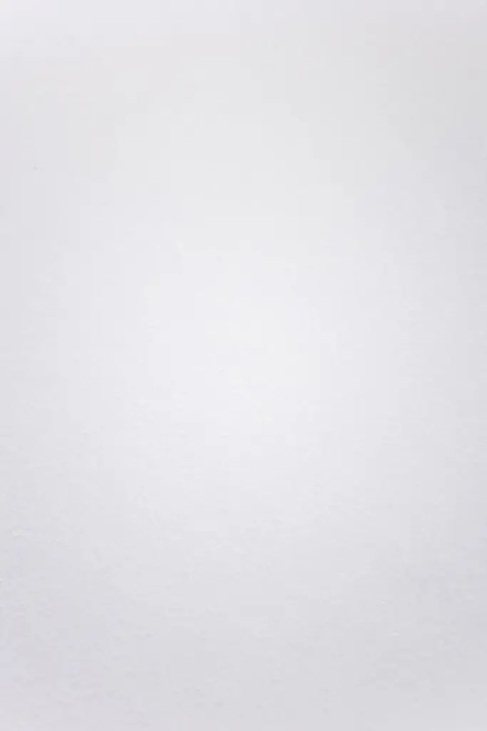 A smooth white textured background suitable for minimalistic design projects.