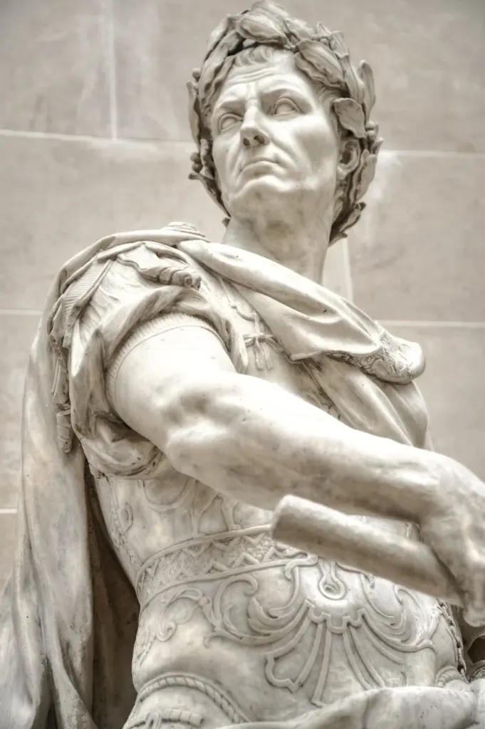 Close-up of an ancient Roman marble statue capturing a historical leader's presence.