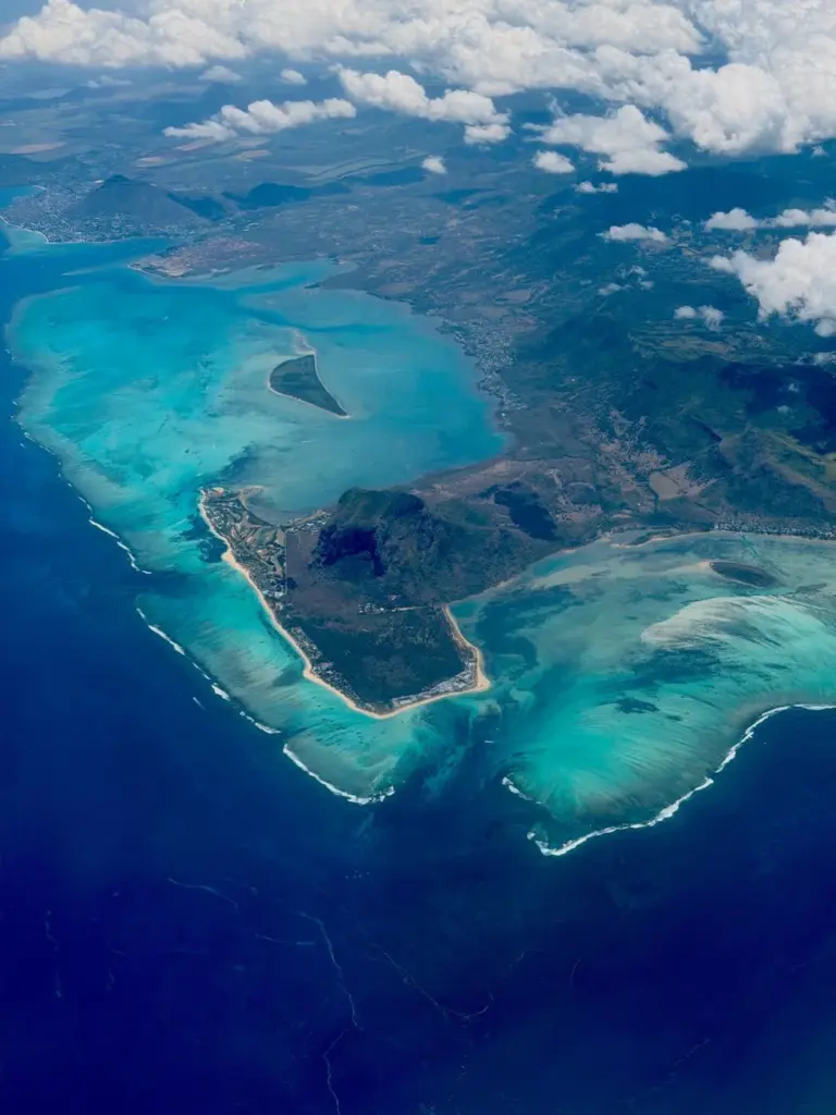 Stunning aerial view of Mauritius with vibrant turquoise waters and lush landscapes.
