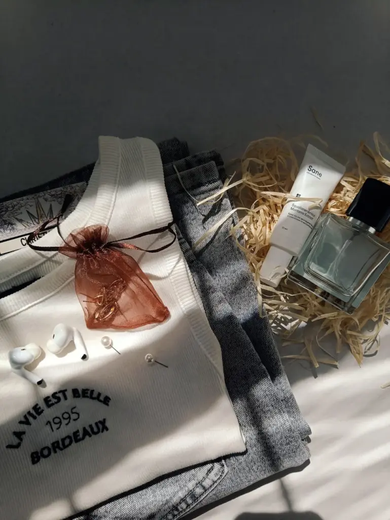Elegant flat lay of fashion items and accessories with a modern aesthetic.
