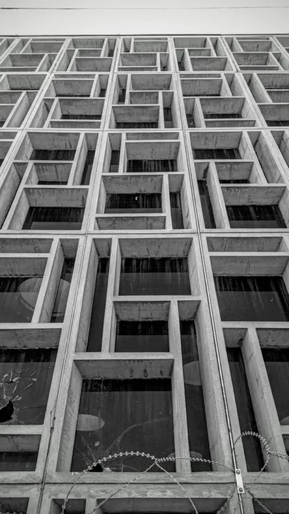 Black and white photo of a geometric facade on an abandoned building in Nicosia, Cyprus.