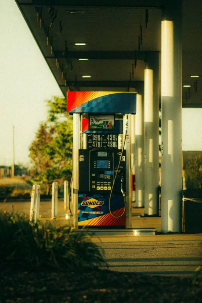 A vibrant Sunoco gas station pump captured at sunset with warm lighting and modern design.