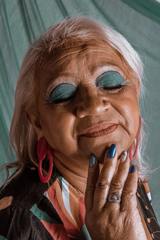 Portrait of an elderly woman with vibrant makeup in São Paulo, Brazil.