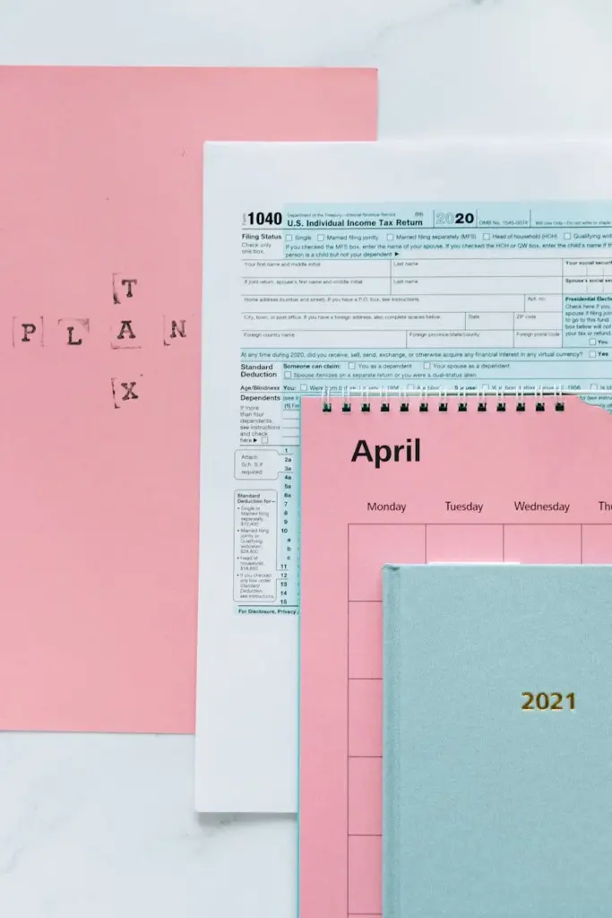 A pastel-themed tax preparation scene with 1040 form, planner, and calendar for April.