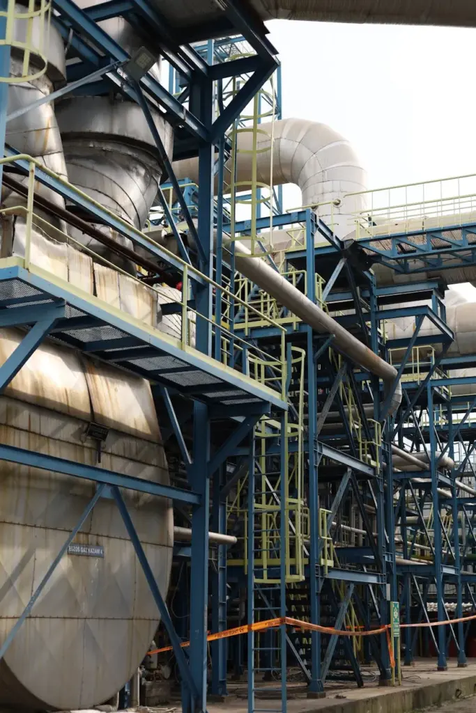 A detailed view of industrial structures and machinery at an urban factory in İzmir, Türkiye.