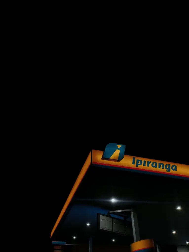 Low angle view of Ipiranga petrol station illuminated at night in Belo Horizonte, Brazil.