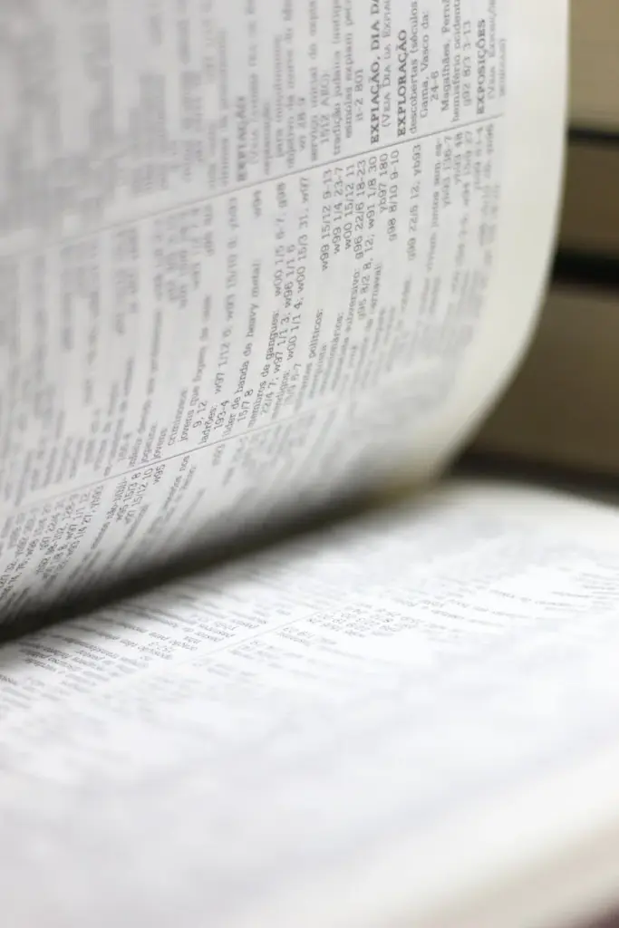 Close-up shot of an open book page, highlighting text details for educational themes.