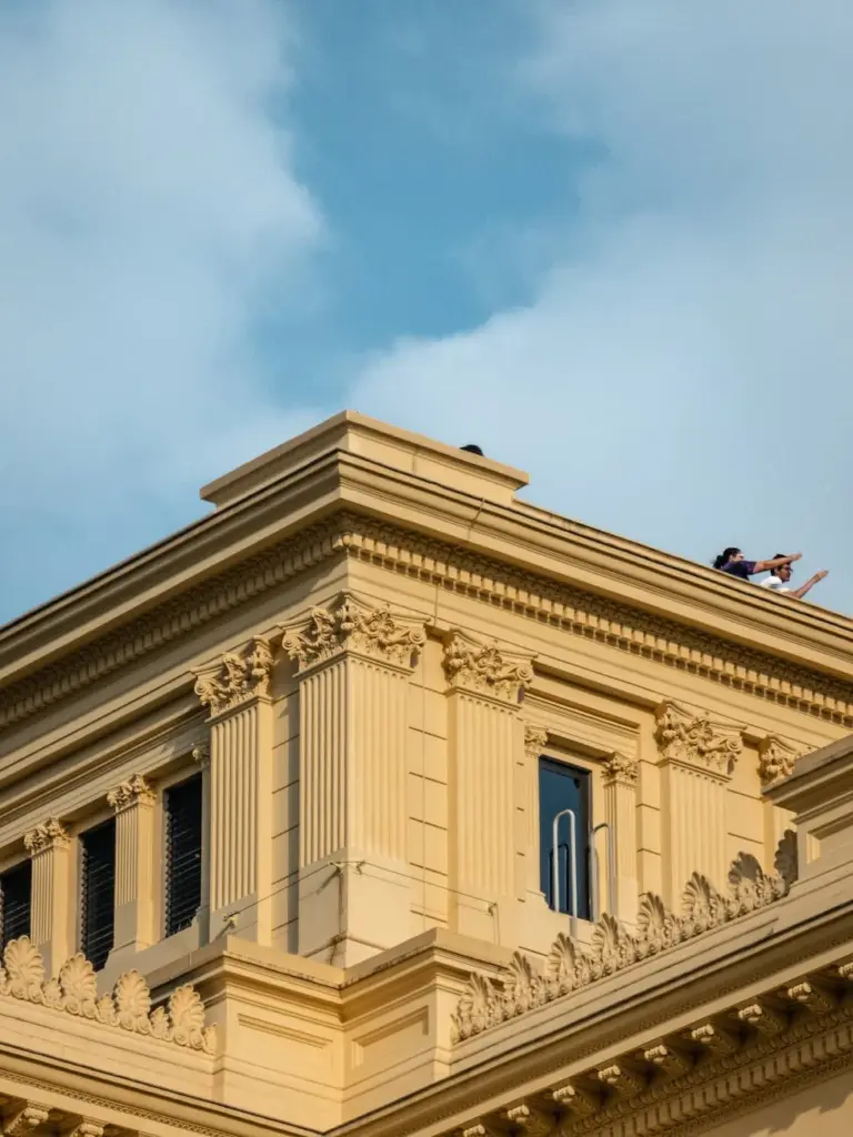 Close-up of historic building in São Paulo, Brasil, showcasing detailed architecture against a clear sky.