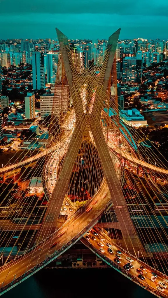 Stunning aerial view of São Paulo's Octavio Frias de Oliveira Bridge at night.