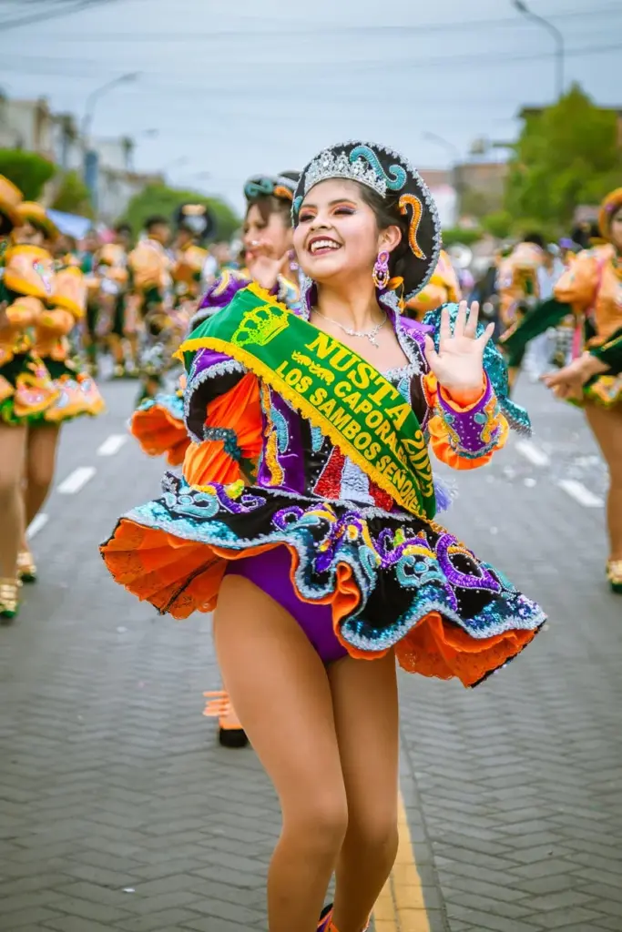 Vibrant traditional dance in a festive parade in Peru featuring ornate costumes.