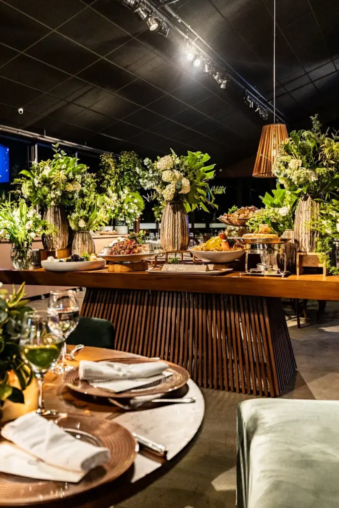Luxurious banquet setting with lavish flower arrangements and elegant table settings.