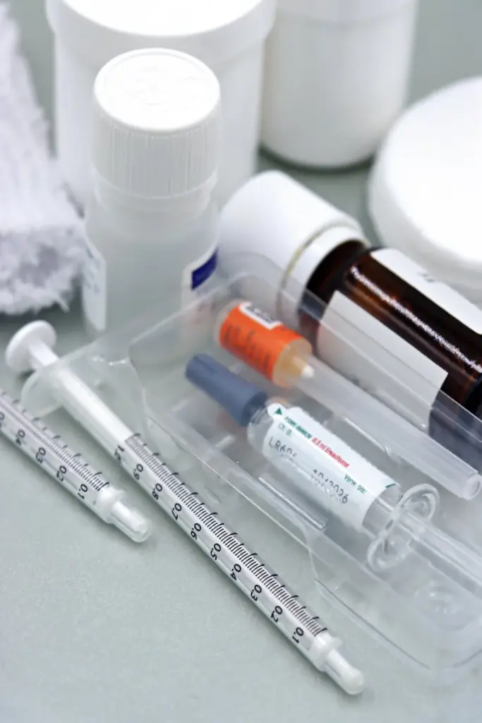 Detailed image of syringes and vaccine vials, illustrating immunization tools.