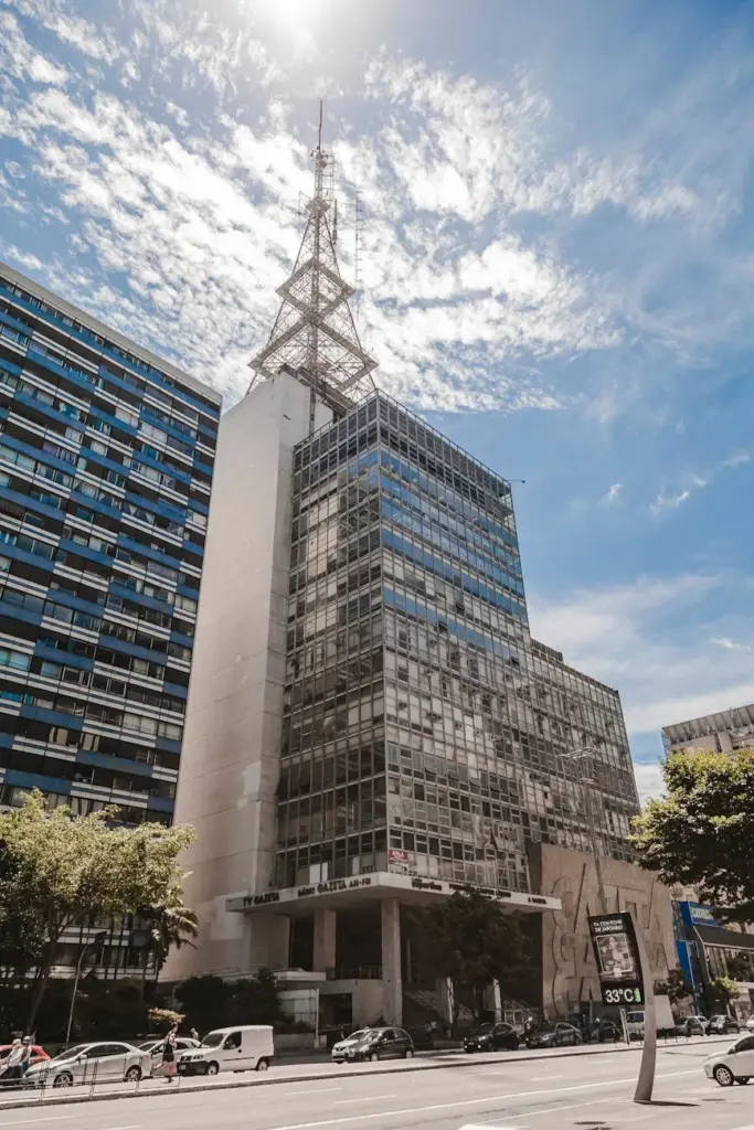 Vertical shot of a modern skyscraper under a vibrant sky in São Paulo, Brazil.