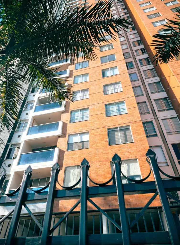 Low angle view of a modern apartment building facade in Bucaramanga, Colombia.