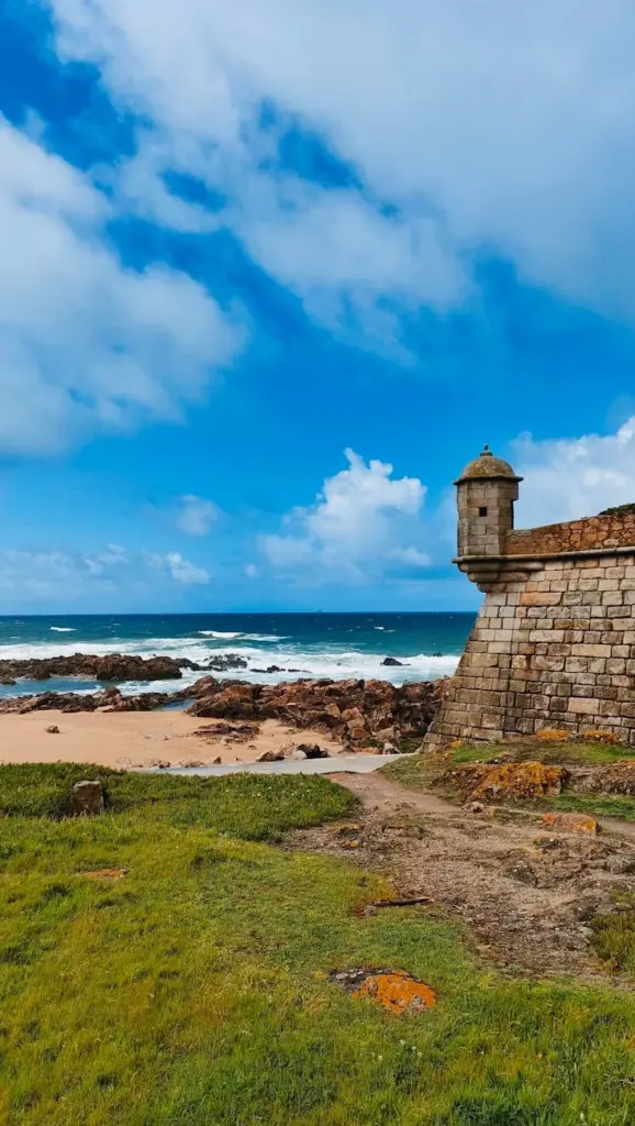 Beautiful coastal view of Foz do Douro with an ancient fort by the Atlantic Ocean in Porto, Portugal.