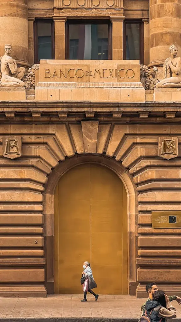 A striking view of Banco de Mexico with detailed sculptures and grand entrance.
