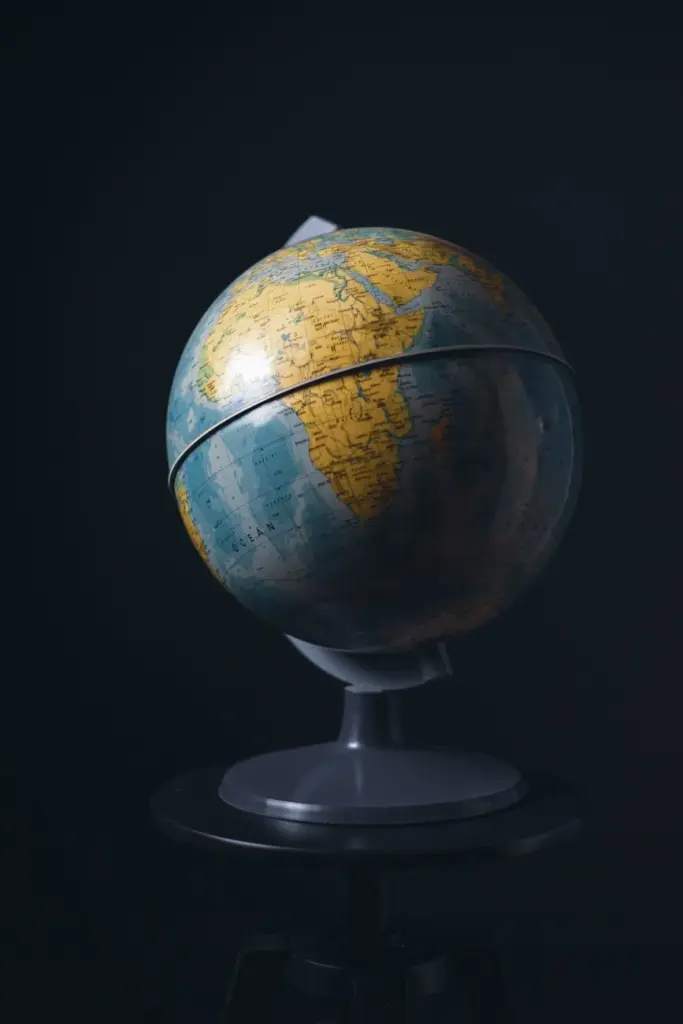 A classic globe on black background representing education and world geography.
