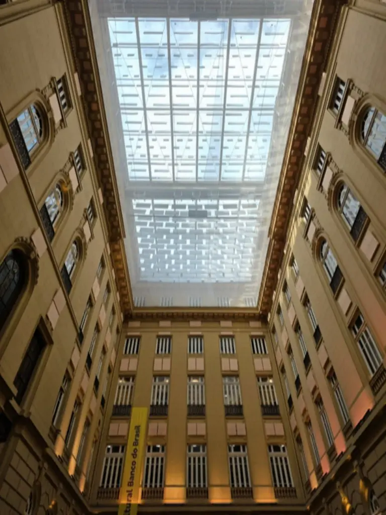 Beautiful indoor atrium with glass ceiling located in a historic building in Brazil.