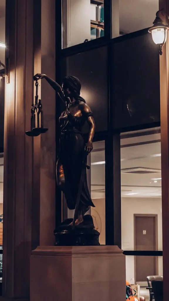Statue of Lady Justice in a sophisticated interior setting in İstanbul, Turkey.