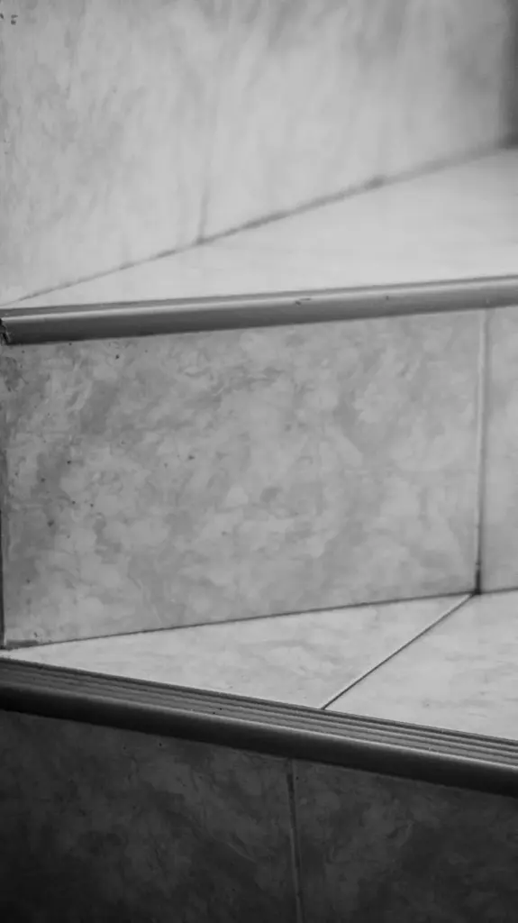 Detailed close-up of a marble staircase captured in black and white.