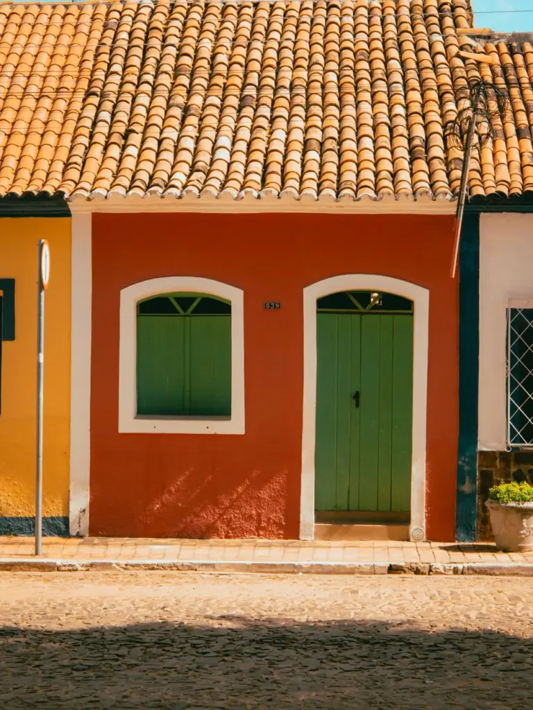 Traditional houses with colorful facades in Pedro II, Brazil, showcasing vibrant architectural style.