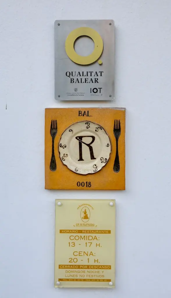 Charming restaurant exterior signage showcasing local culinary heritage in Eivissa, Spain.