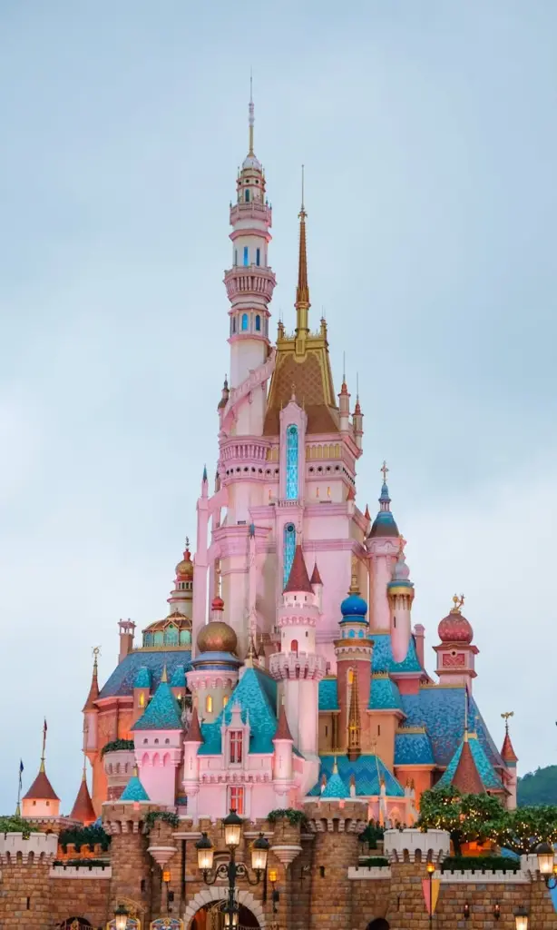 Colorful view of Sleeping Beauty Castle in Hong Kong Disneyland during daytime.