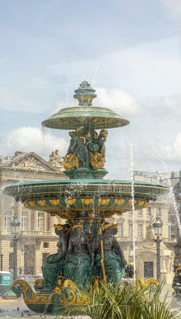 Captivating view of the ornate Fontaine des Mers at Place de la Concorde in Paris, showcasing intricate sculptures.