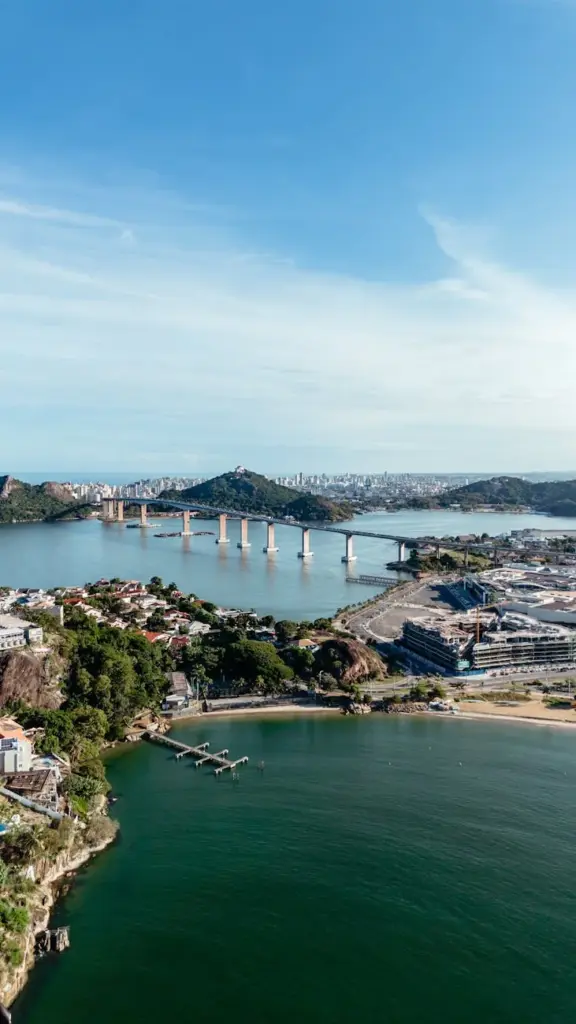 Stunning aerial view of the famous Third Bridge in Vitoria, Brazil, showcasing vibrant cityscape and coastline.