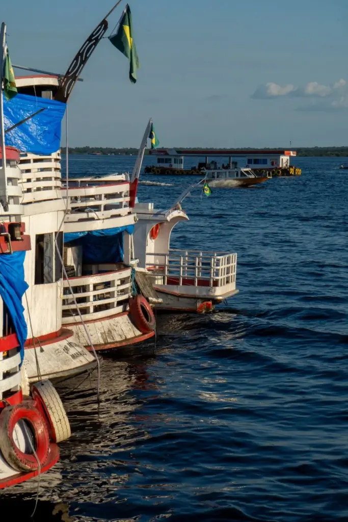 Colorful boats docked on the Amazon River in Manaus, Brasil, by a sunny day.