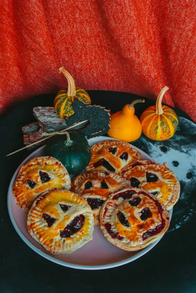 Festive pumpkin pies with spooky decoration for a Halloween celebration.