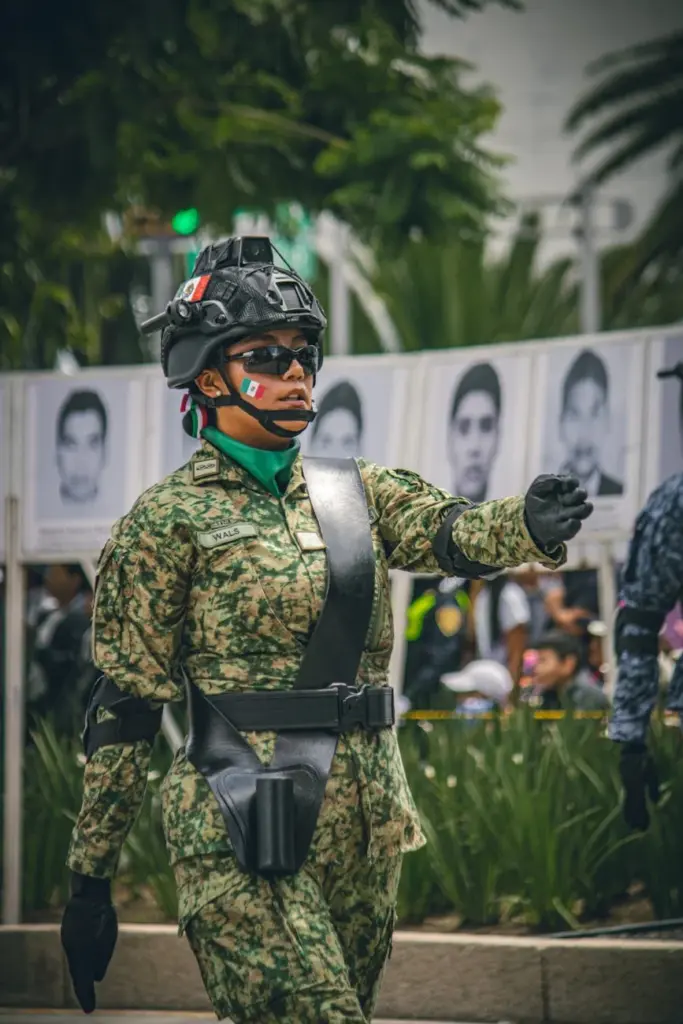 A female soldier in a parade in Mexico City, showcasing strength and patriotism.
