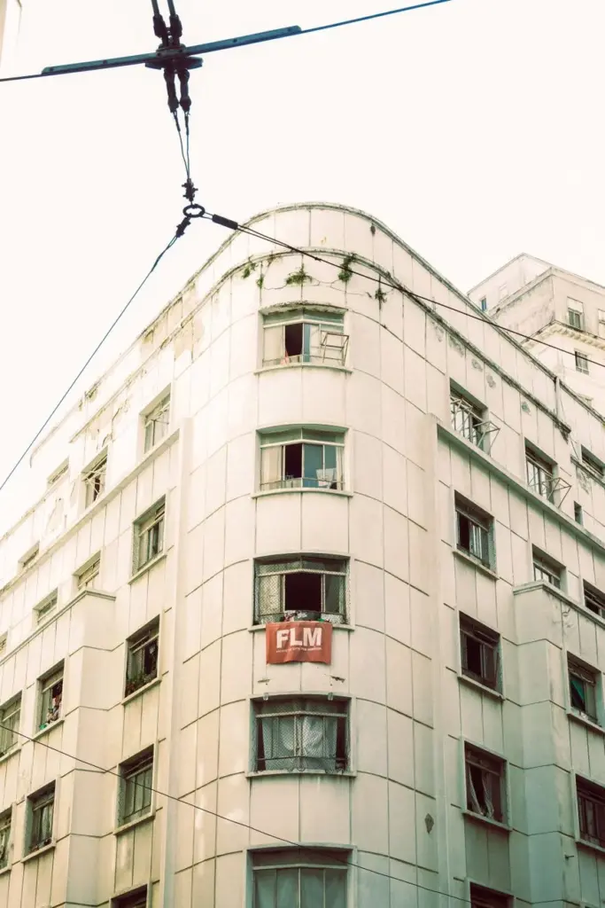 Artistic shot of a vintage multi-story building in an urban setting, capturing an old charm.