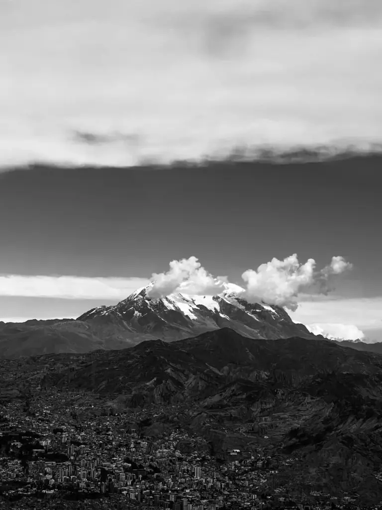 Stunning monochrome view of Illimani Mountain towering over La Paz, Bolivia.